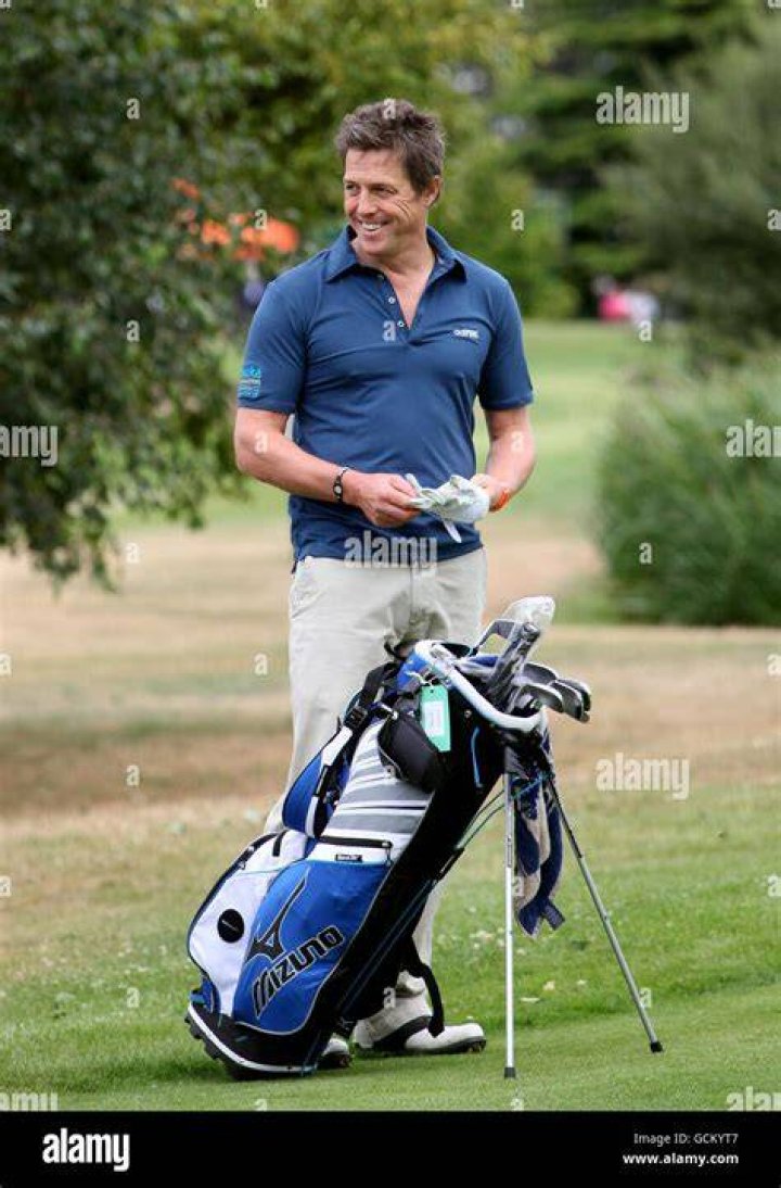 Hugh Grant plays golf
