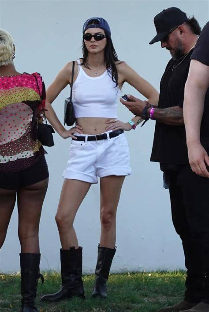 Indio, CA - *EXCLUSIVE* - Kendall Jenner and Hailey Baldwin rush to the Jaden Smith show to cheer on their friend as Jordyn Woods makes a guest appearance on stage amidst the family feud. Hailey is seen sporting a necklace that reads "Bieber" perhaps to remind her of her husband Justin Bieber while she enjoys the show without him by her side. Pictured: Kendall Jenner, Hailey Baldwin, Hailey Bieber BACKGRID USA 13 APRIL 2019 USA: +1 310 798 9111 / UK: +44 208 344 2007 / *UK Clients - Pictures Containing Children Please Pixelate Face Prior To Publication*