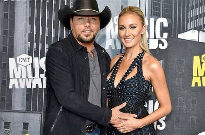 Jason Aldean, left, and Brittany Kerr arrive at the 52nd annual Academy of Country Music Awards at the T-Mobile Arena in Las Vegas. Aldean announced on May 8, 2017, that he and Kerr are expecting their first child together People Jason Aldean, Las Vegas, USA - 2 Apr 2017