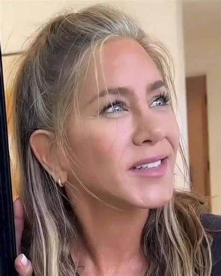 Jennifer Aniston in a grey power suit