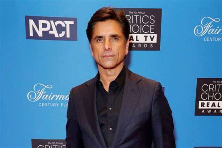John Stamos presents the choice male web star award at the Teen Choice Awards, in Hermosa Beach, Calif 2019 Teen Choice Awards - Show, Hermosa Beach, USA - 11 Aug 2019