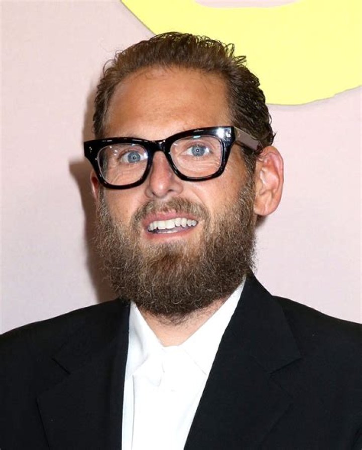 Jonah Hill gives a serious look while protesting