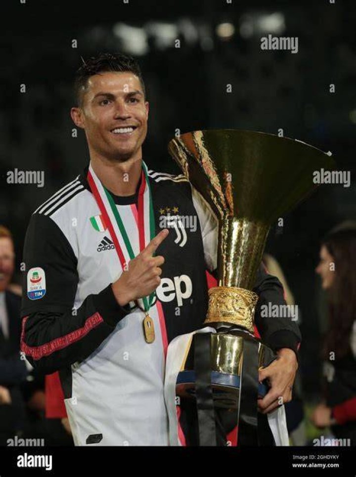 Juventus player Cristiano Ronaldo holding the Serie A title trophy celebrates with his girlfriend Georgina Rodriguez at the end of the Italian Serie A soccer match Juventus FC vs Atalanta BC at the Allianz Stadium in Turin, Italy, 19 May 2019. Serie A soccer match Juventus FC vs Atalanta BC, Turin, Italy - 19 May 2019