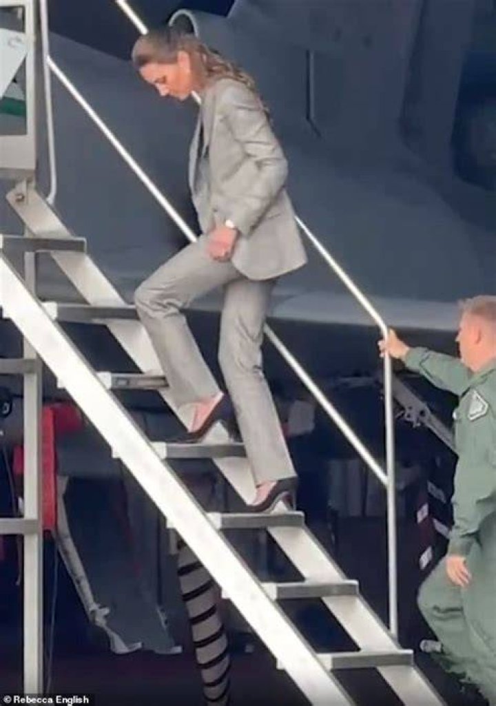 Kate Middleton walks down stairs with Prince George