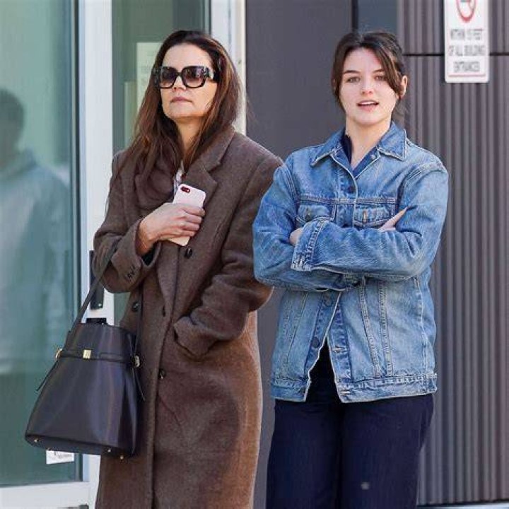 Katie Holmes & Suri Cruise cross a street
