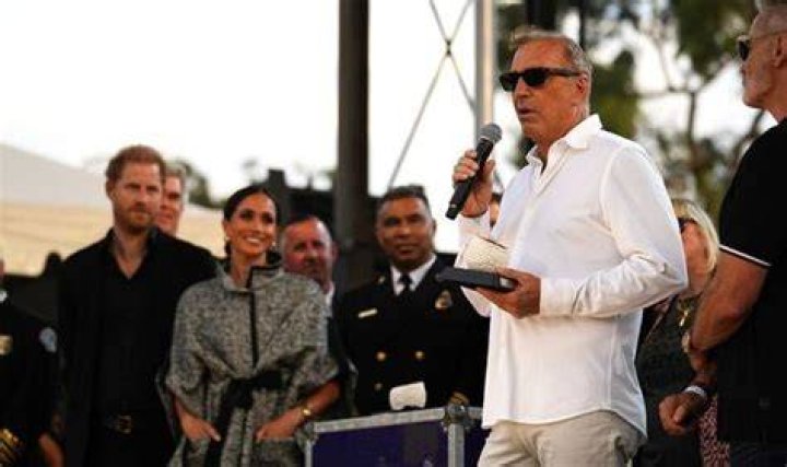Kevin Costner posing at event and Princess Diana in a dress