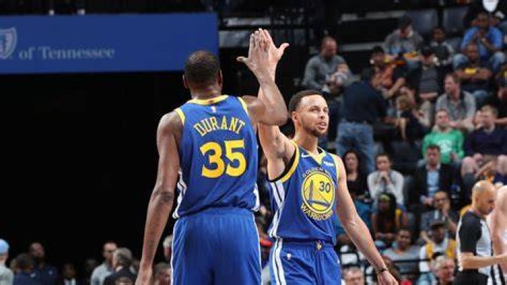 Kevin Durant and Stephen Curry Cleveland Cavaliers at Golden State Warriors, Oakland, USA - 12 Jun 2017 Golden State Warriors player Kevin Durant (L) laughs with teammate Stephen Curry (C) holding one of his daughters while celebrating after winning the NBA Finals against the Cleveland Cavaliers in game five of the NBA Finals.