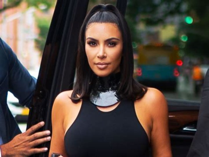 kim-kardashian-may-28-black-coat-white-dress-ftr