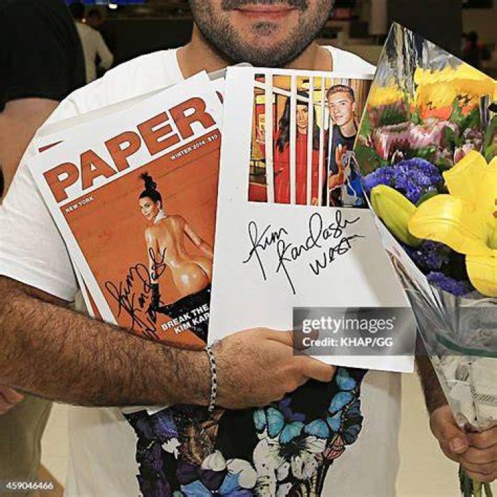 Kim Kardashian with Papers