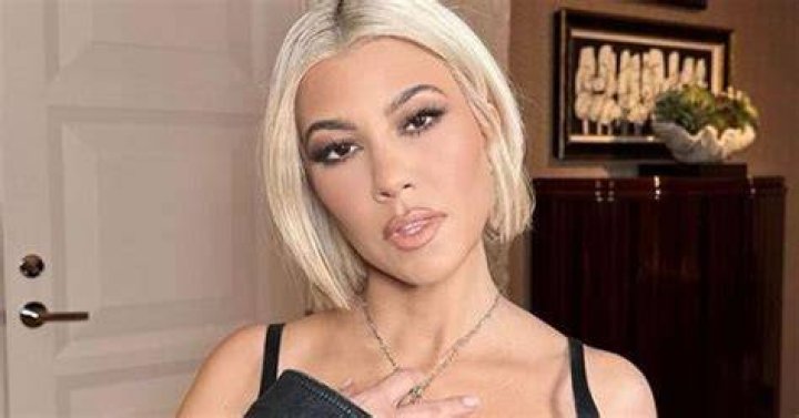 Kourtney Kardashian Rocks A Plunging Swimsuit