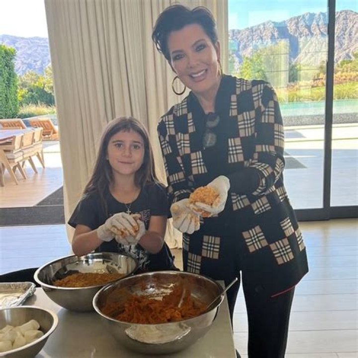 Kris Jenner with Penelope Disick on a carousel