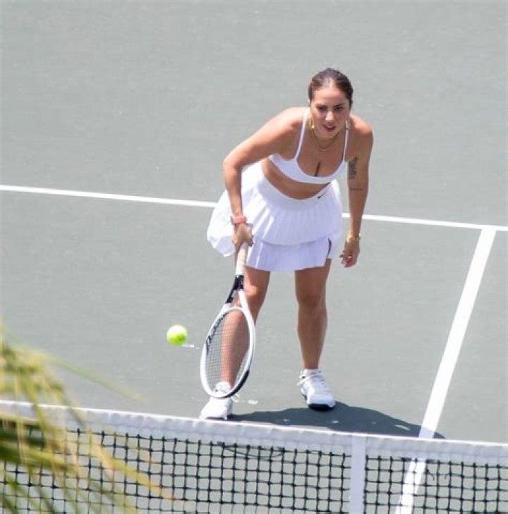 Lady Gaga plays tennis on a trip with her boyfriend