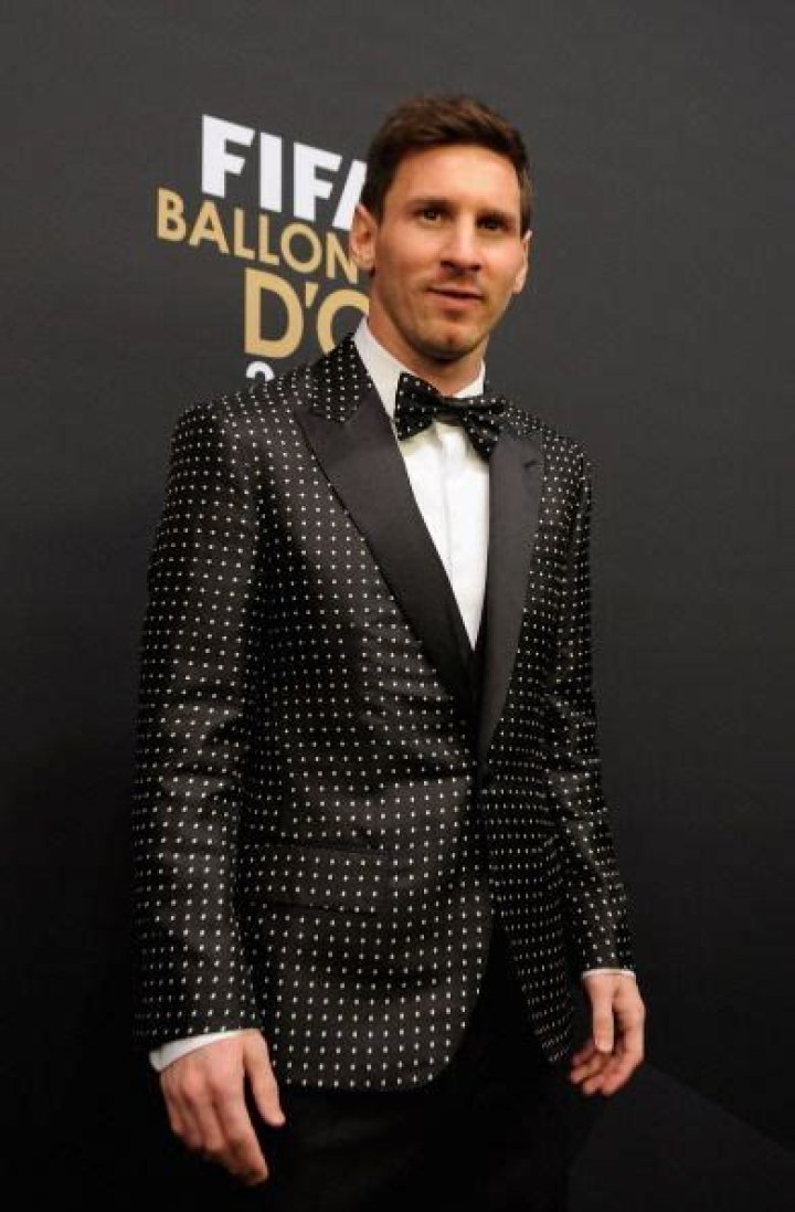 Lionel Messi in a suit and tie