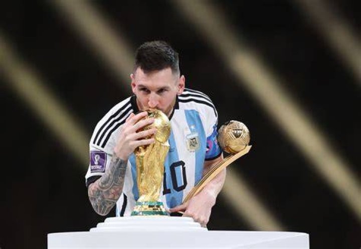 Lionel Messi with an award