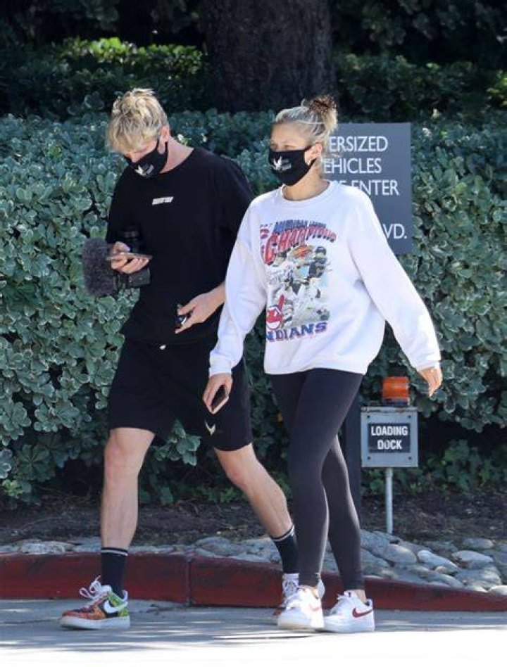 Logan Paul & Josie Canseco walking as part of a protest