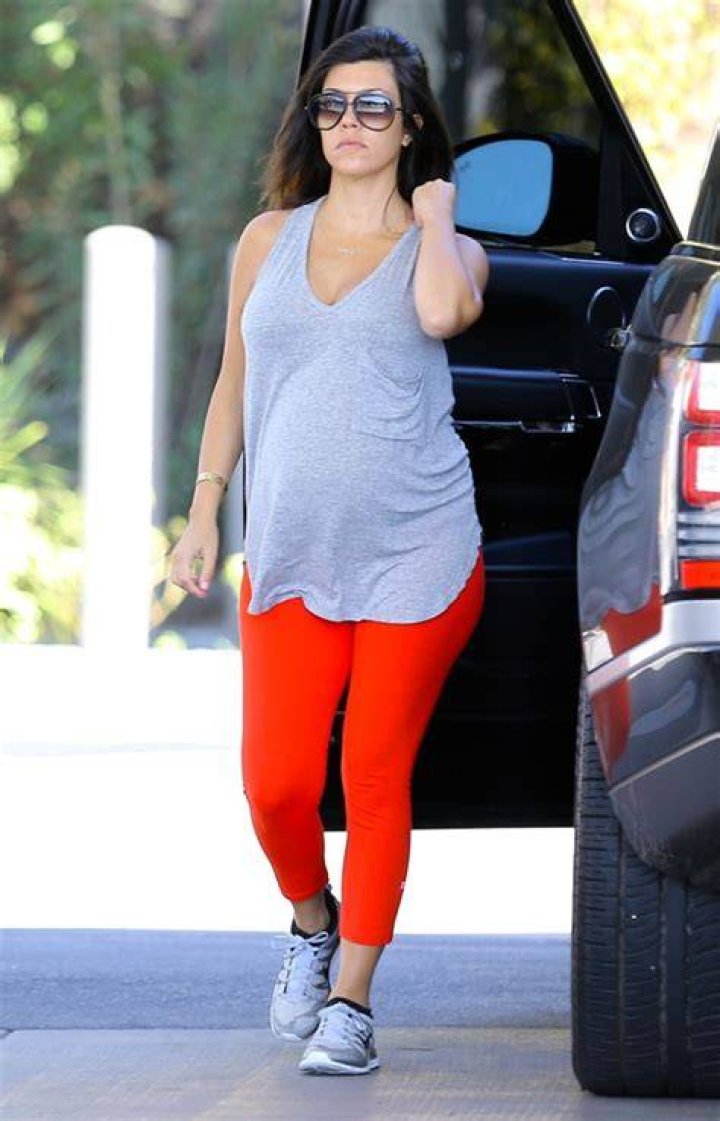 Los Angeles, CA - *EXCLUSIVE* - Kourtney Kardashian confidently shows off her baby bump while holding hands with Travis Barker as they go for a coffee run near their Calabasas home. Travis exudes a cool vibe, while Kourtney rocks a stylish all-black outfit and completes her look with sunglasses. Pictured: Kourtney Kardashian,Travis Barker BACKGRID USA 20 JULY 2023 USA: +1 310 798 9111 / UK: +44 208 344 2007 / *UK Clients - Pictures Containing Children Please Pixelate Face Prior To Publication*