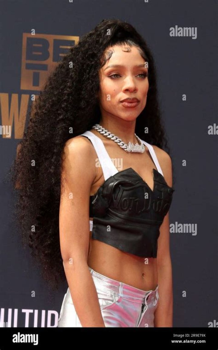 Los Angeles, CA - *EXCLUSIVE* - Lil Wayne's daughter Reginae Carter arrives at her dad's early birthday celebration in L.A. wearing a little black dress after being attacked by music personality DJ Akademik's unsolicited remarks about her relationship with Youtuber A'rmon Warren. Pictured: Reginae Carter BACKGRID USA 26 SEPTEMBER 2022 USA: +1 310 798 9111 / UK: +44 208 344 2007 / *UK Clients - Pictures Containing Children Please Pixelate Face Prior To Publication*