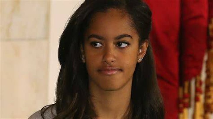 Malia Obama in a white jumpsuit