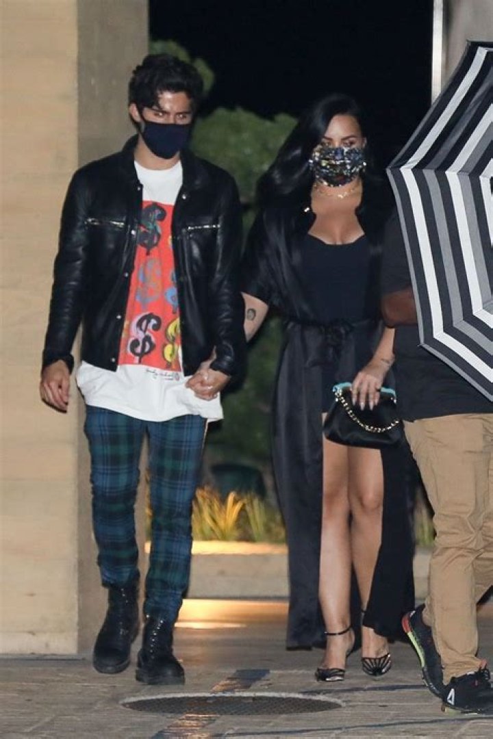 Malibu, CA - Demi Lovato and Max Ehrich are escoted back to their car by security after a dinner date at Nobu in Malibu. Pictured: Demi Lovato, Max Ehrich BACKGRID USA 22 JULY 2020 BYLINE MUST READ: Roger / BACKGRID USA: +1 310 798 9111 / UK: +44 208 344 2007 / *UK Clients - Pictures Containing Children Please Pixelate Face Prior To Publication*