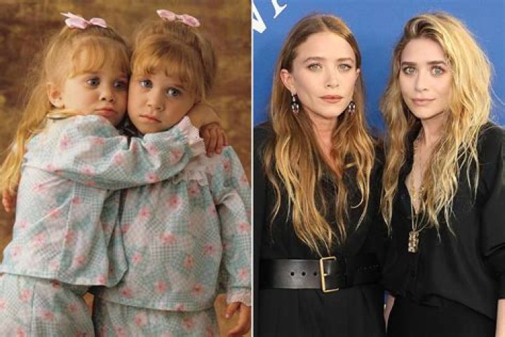 Mary-kate and Ashley Olsen Smiling and Wearing Sunglasses Standing On the Sidewalk Together On 8-11-1996 Mary-kate Olsen and Ashley Olsen 1996