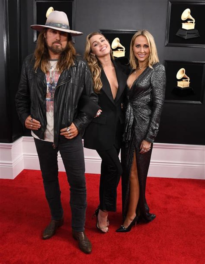 Miley Cyrus,Tish Cyrus, Billy Ray Cyrus. Miley Cyrus, from left, Tish Cyrus and Billy Ray Cyrus arrive at MusiCares Person of the Year honoring Dolly Parton, at the Los Angeles Convention Center 2019 MusiCares Person of the Year - Arrivals, Los Angeles, USA - 08 Feb 2018