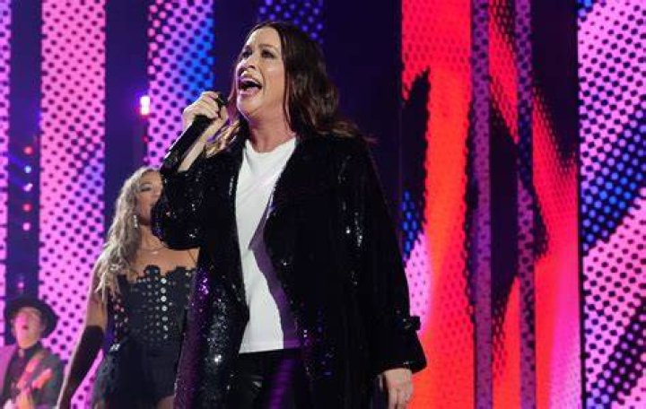MORISETTE Alanis Morissette thanks her producers after winning the "Album of the Year" at the 38th annual Grammy Awards at the Shrine Auditorium in Los Angeles GRAMMYS, LOS ANGELES, USA