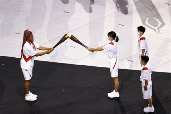 Naomi Osaka carries the Olympic Torch during the opening ceremony in the Olympic Stadium at the 2020 Summer Olympics, in Tokyo, Japan Olympics Opening Ceremony, Tokyo, Japan - 23 Jul 2021