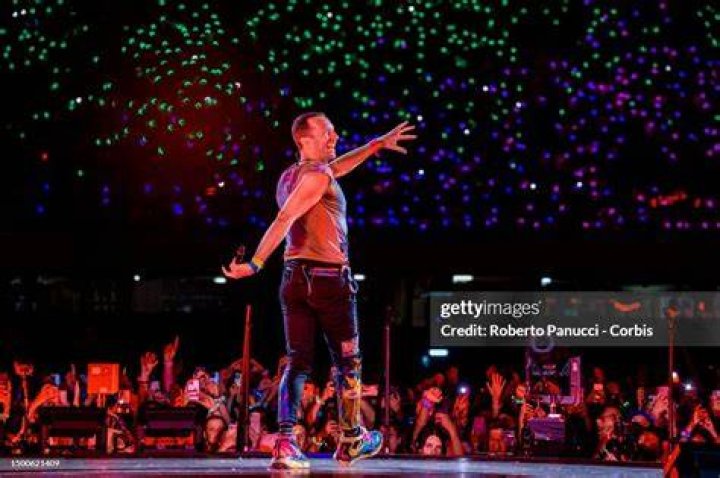 Naples, ITALY - *EXCLUSIVE* - Coldplay Frontman Chris Martin during the Coldplay concert at the Stadio Maradona in Naples. During the performance, Chris got off stage and reached out to his partner the American Actress Dakota Johnson as she blew a few kisses whilst saying hello and in full support to her beloved beau. Pictured: Chris Martin - Dakota Johnson BACKGRID USA 23 JUNE 2023 USA: +1 310 798 9111 / UK: +44 208 344 2007 / *UK Clients - Pictures Containing Children Please Pixelate Face Prior To Publication*