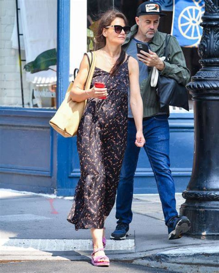 New York, NY - Katie Holmes' ever-growing daughter, Suri Cruise, 16, wears a white dress and blue Converse sneakers for a morning stroll in New York City. Pictured: Suri Cruise BACKGRID USA 20 JULY 2022 BYLINE MUST READ: Robert O'Neil/Backgrid / BACKGRID USA: +1 310 798 9111 / UK: +44 208 344 2007 / *UK Clients - Pictures Containing Children Please Pixelate Face Prior To Publication*