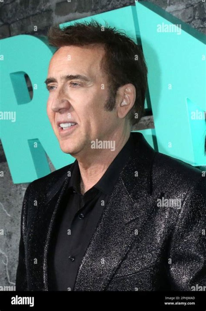 New York, NY - Nicolas Cage with his daughter August and wife Riko Shibata arrive at JFK airport in NYC. Pictured: Nicolas Cage BACKGRID USA 25 MARCH 2023 USA: +1 310 798 9111 / UK: +44 208 344 2007 / *UK Clients - Pictures Containing Children Please Pixelate Face Prior To Publication*