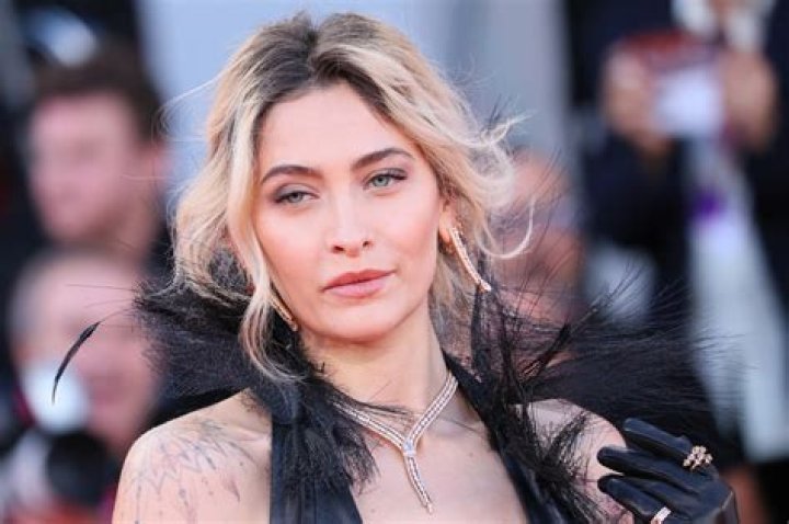 Paris Jackson holds a sign