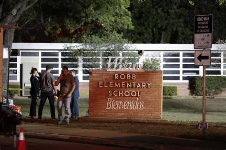 Police walk near Robb Elementary School following a shooting, in Uvalde, Texas Texas School-Shooting, Uvalde, United States - 24 May 2022