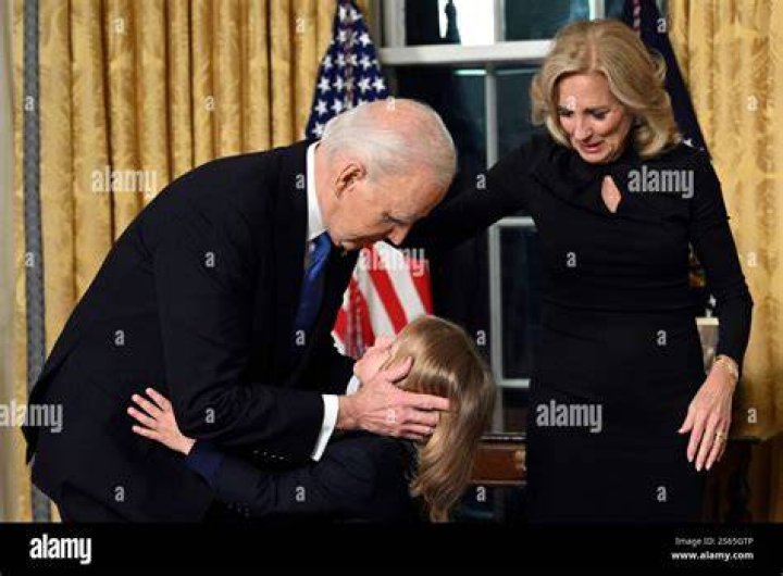 President Joe Biden hugs first lady Jill Biden as they arrive at the North Portico of the White House, Wednesday, Jan. 20, 2021, in Washington. (AP Photo/Evan Vucci)