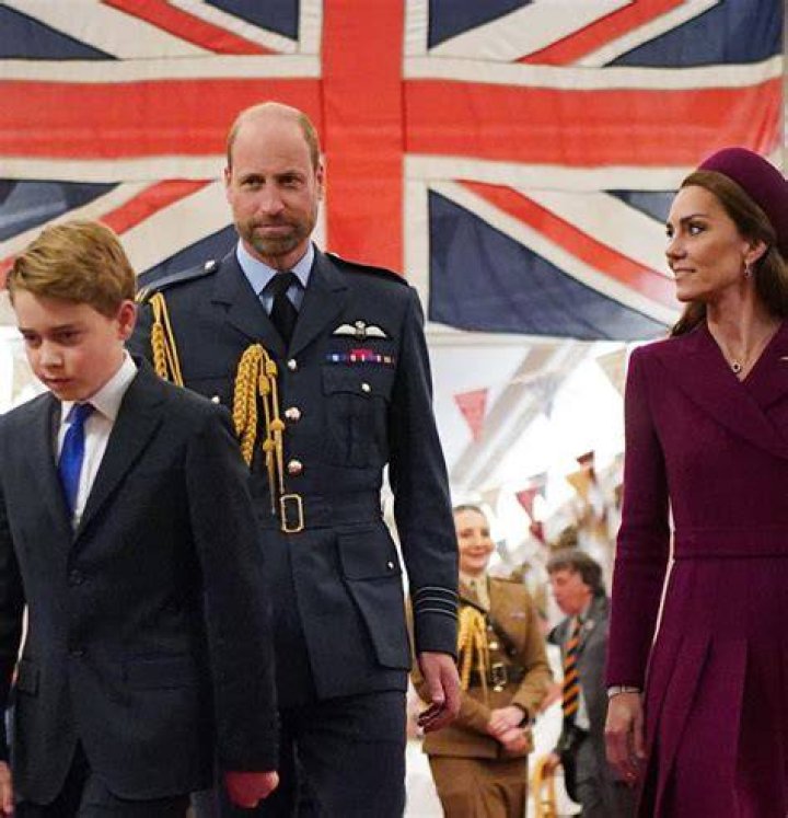 Prince George walking in front of Princess Charlotte