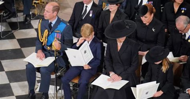 Prince George wipes his eye