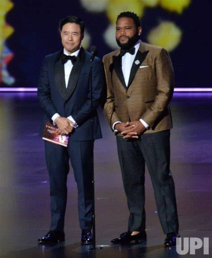 Randall Park and Anthony Anderson present during the 71st annual Primetime Emmy Awards
