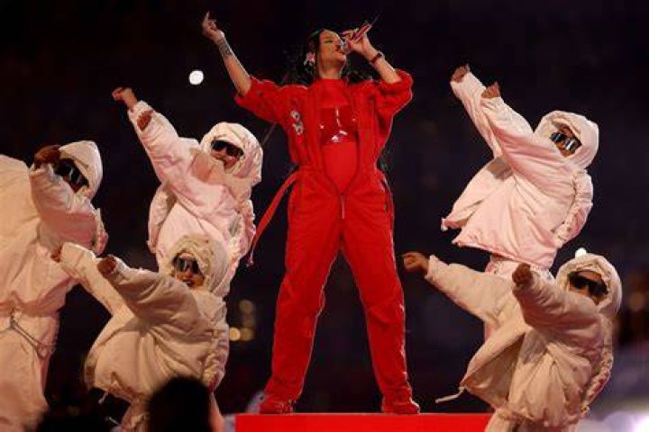 Rihanna performing during the halftime show Philadelphia Eagles v Kansas City Chiefs, Super Bowl LVII, NFL, Half Time Show, University of Phoenix Stadium, Glendale Arizona, USA - 12 Feb 2023 Wearing Alaia, Coat, Wearing Loewe, Breast Plate
