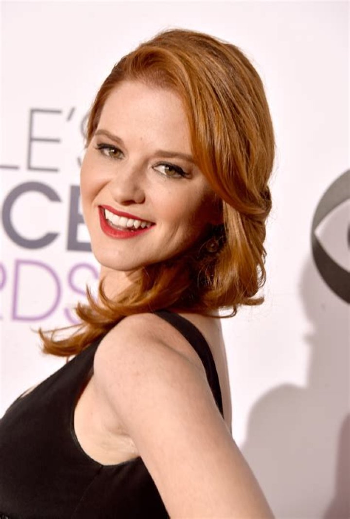 Sarah Drew in a black dress