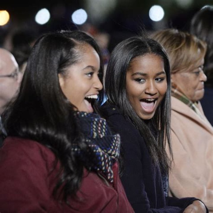 Sasha Obama, Malia Obaman Sasha Obama, right, and Malia Obama, laugh during the National Christmas Tree Lighting ceremony at the Ellipse in Washington Obama National Christmas Tree, Washington, USA