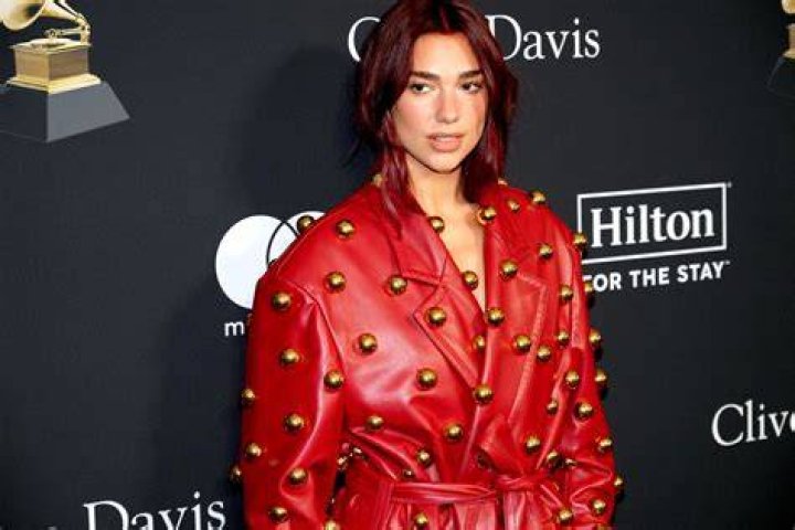 Singer Dua Lipa wears an orange bikini as she hits the beach after a sold out concert in Miami. 10 Feb 2022 Pictured: Dua Lipa. Photo credit: MEGA TheMegaAgency.com +1 888 505 6342 (Mega Agency TagID: MEGA827166_020.jpg) [Photo via Mega Agency]