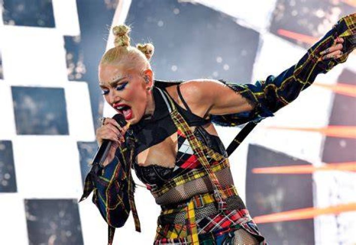 Superstar Gwen Stefani took her family to Walt Disney World, Orlando, during a fun timeout from her 'This Is What The Truth Feels Like' US tour, on Monday (july 25). The 46-year-old performer and judge on hit TV show The Voice wore denim dungarees for her visit to the famous Magic Kingdom theme park despite the soaring Florida heat, proving once again that she's the 'Queen of Cool'. Her long, platinum blonde locks were immaculately braided and she wore her trademark red lipstick even as the temperatures reached 100 degrees. She is seen posing with Mickey Mouse wearing a baseball cap with the hashtag #TRUTH, as a nod to her tour. Photo: Chloe Rice / Disney World Pictured: gwen stefani,mickey mouse,gwen stefani mickey mouse Ref: SPL1324626 250716 NON-EXCLUSIVE Picture by: SplashNews.com Splash News and Pictures USA: +1 310-525-5808 London: +44 (0)20 8126 1009 Berlin: +49 175 3764 166 World Rights