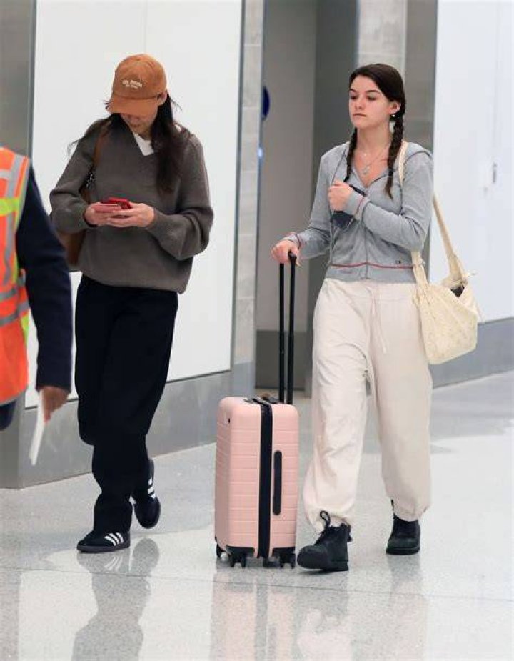 Suri Cruise at an airport