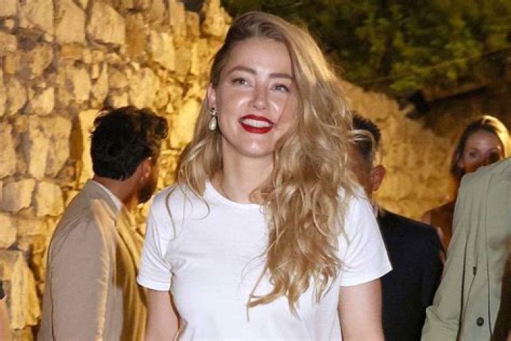 Taormina, ITALY - Actress Amber Heard greets fans while promoting her new film "In the Fire" at the 69th Taormina Film Festival. Pictured: Amber Heard BACKGRID USA 24 JUNE 2023 BYLINE MUST READ: Cobra Team / BACKGRID USA: +1 310 798 9111 / UK: +44 208 344 2007 / *UK Clients - Pictures Containing Children Please Pixelate Face Prior To Publication*