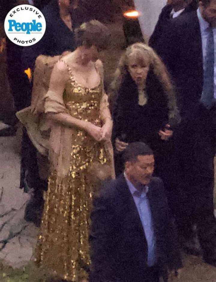 Taylor Swift dazzles in golden flowing dress as she shakes it off as fans show her love in the front rows at her opeing night of her Era tour in Arizona. 18 Mar 2023 Pictured: Taylor Swift. Photo credit: Brian Prahl/MEGA TheMegaAgency.com +1 888 505 6342 (Mega Agency TagID: MEGA958257_001.jpg) [Photo via Mega Agency]