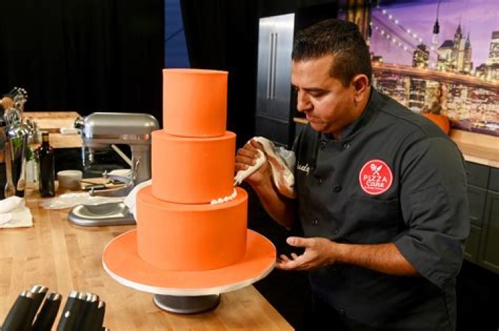 The Cake Boss, Buddy Valastro, poses in front of Carlo's Bakery's first ever Sweet Room at the grand opening at Mohegan Sun, in Uncasville, Conn Carlo&acirc;?&trade;s Bakery Grand Opening at Mohegan Sun, Uncasville, USA - 12 Sep 2015