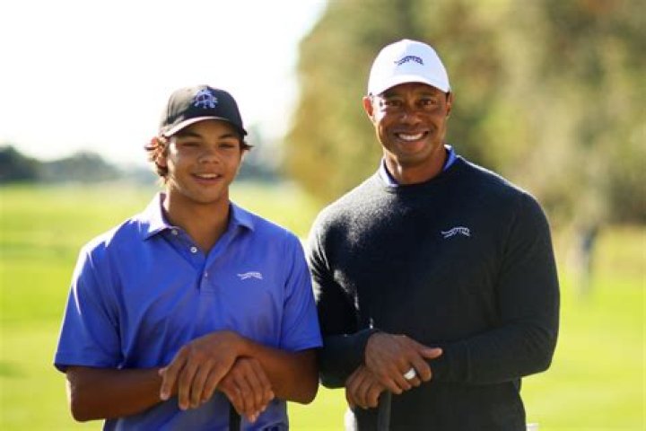 Tiger Woods and his son Charlie Woods wait to tee off on the first hole during the first round of the 2022 PNC Championship at The Ritz-Carlton Golf Club in Orlando. PNC Championship Golf Tournament in Orlando, US - 17 Dec 2022
