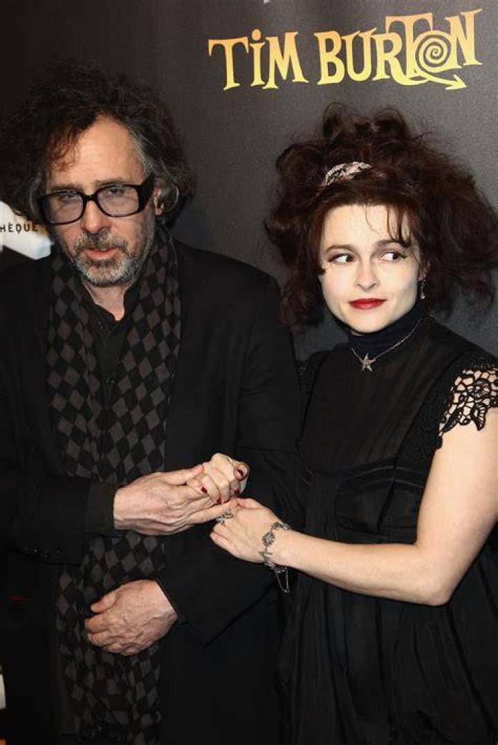 Tim Burton, Helena Bonham-Carter Filmmaker Tim Burton, left, and his wife Helena Bonham-Carter, pose as they arrive for the opening of his exhibition, a retrospective of his work, in ParisFrance Tim Burton, Paris, France