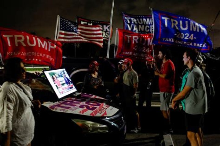 Two Supporters Watch Election Night Results Come In