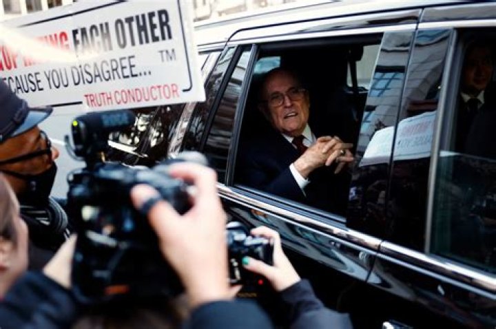 WASHINGTON, DC - DECEMBER 15: Rudy Giuliani, the former personal lawyer for former U.S. President Donald Trump, speaks with reporters outside of the E. Barrett Prettyman U.S. District Courthouse after a verdict was reached in his defamation jury trial on December 15, 2023 in Washington, DC. A jury has ordered Giuliani to pay $148 million in damages to Fulton County election workers Ruby Freeman and Shaye Moss. (Photo by Anna Moneymaker/Getty Images)