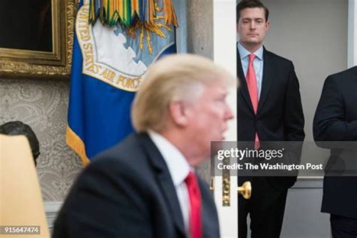 White House Staff Secretary Rob Porter (L) Senior Advisor to the President Stephen Miller, (C) and Director of the National Economic Council and chief economic advisor Gary Cohn, ( R)walk on the South Lawn as they return with the US President (out of frame) to the White House in Washington, DC USA, 18 January 2018. The president was returning from a trip to Pittsburgh, Pennsylvania. Trump Arrives at the White House, Washington, USA - 18 Jan 2018